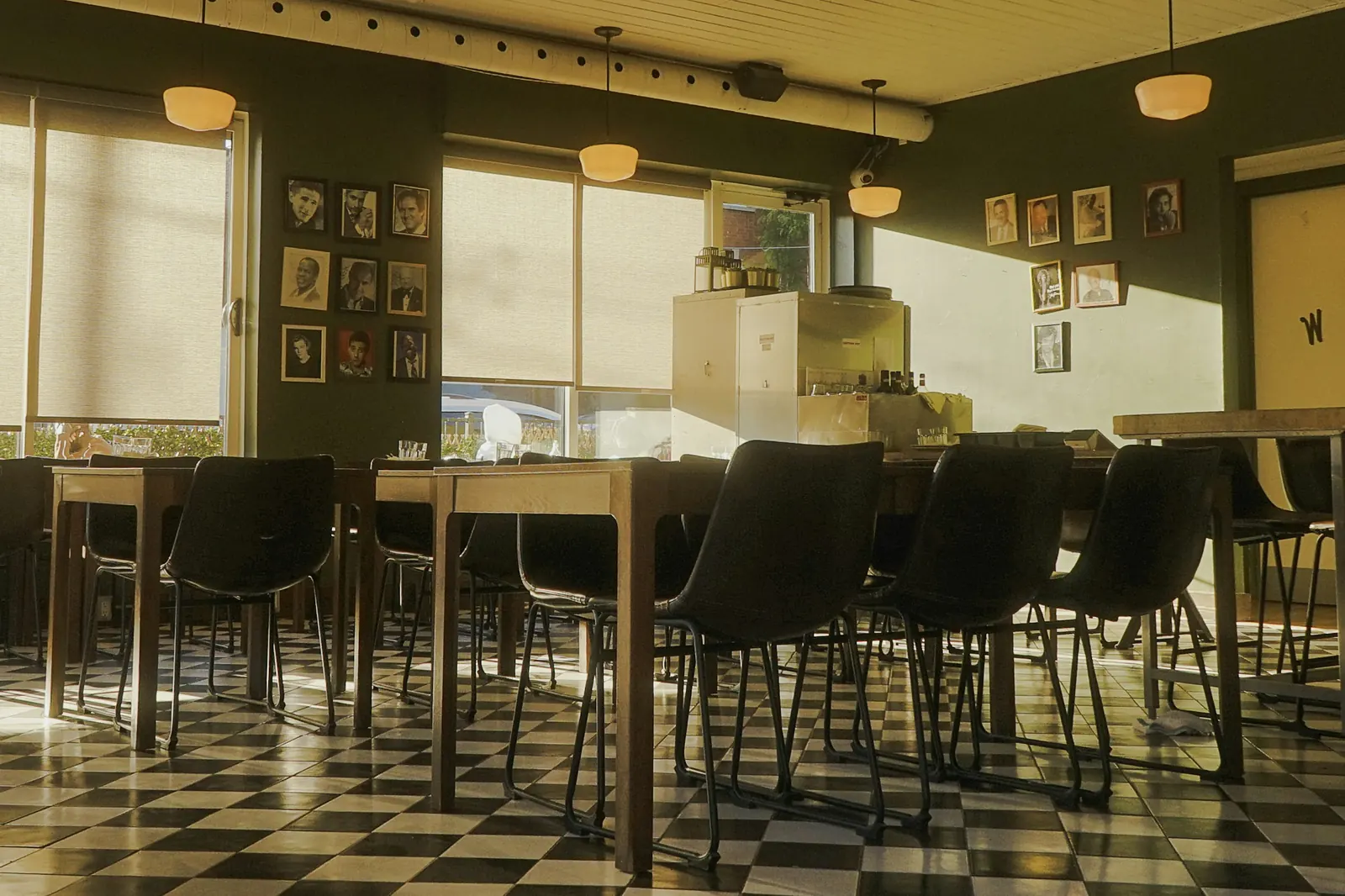 Empty café dining room in warm evening light, ready for opening